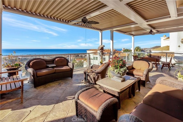 view of patio featuring a water view, an outdoor hangout area, and ceiling fan