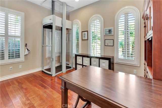 office with hardwood / wood-style flooring