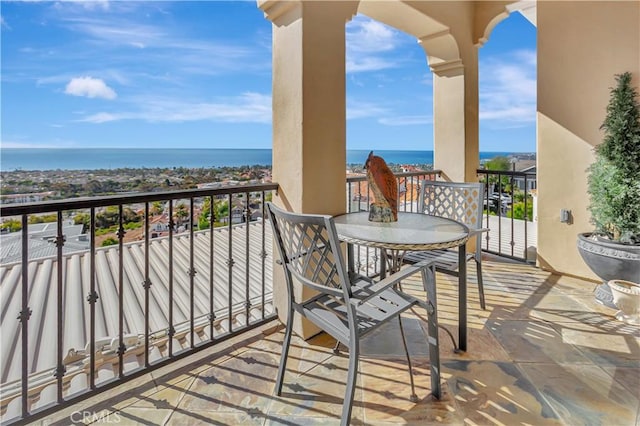 balcony featuring a water view