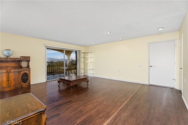 living room featuring dark wood-type flooring