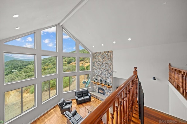 interior space featuring vaulted ceiling with beams and hardwood / wood-style floors