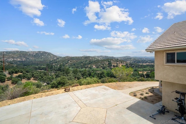 view of patio / terrace featuring a mountain view