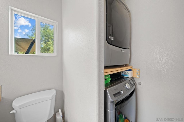 laundry room with stacked washer and clothes dryer