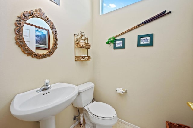 bathroom with toilet and sink