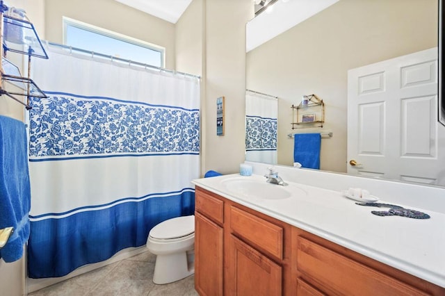 bathroom with vanity, toilet, and tile patterned flooring