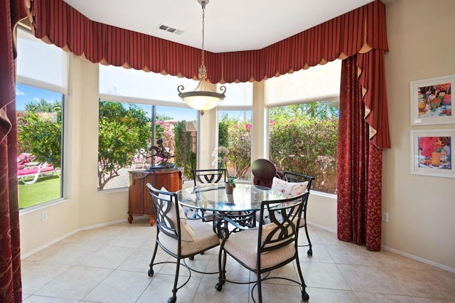 dining space featuring light tile patterned floors