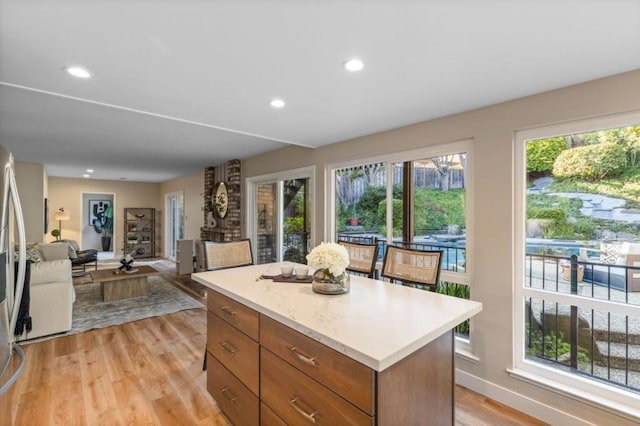 kitchen with a center island and light wood-type flooring