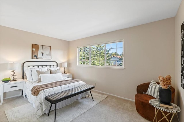 bedroom featuring light carpet