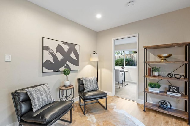 sitting room with light hardwood / wood-style flooring