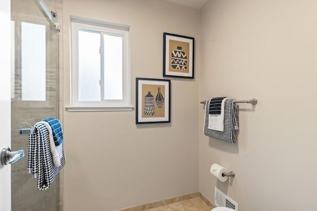 bathroom with tile patterned floors