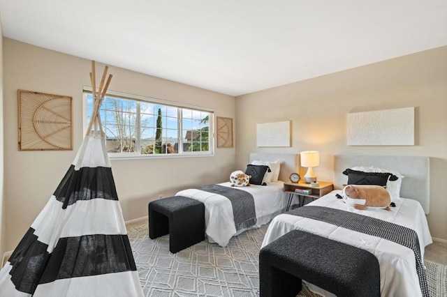 bedroom featuring light colored carpet