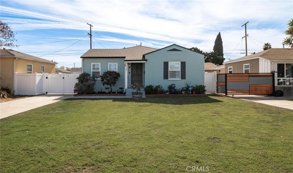 bungalow-style house with a front lawn