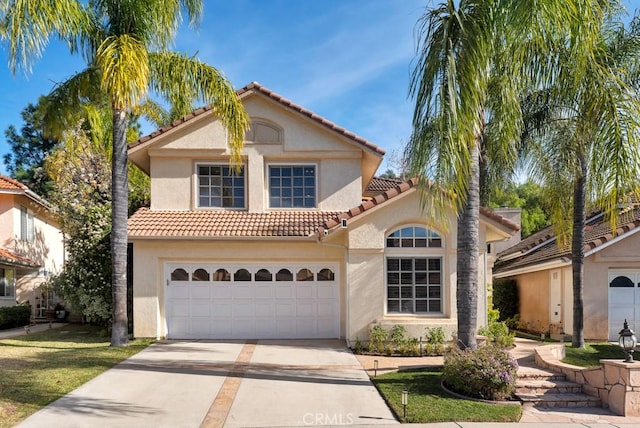 mediterranean / spanish-style house featuring a garage