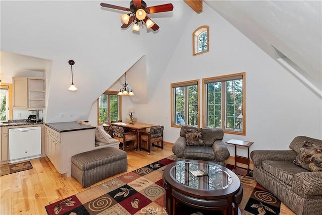 living room featuring high vaulted ceiling, ceiling fan, and light wood-type flooring