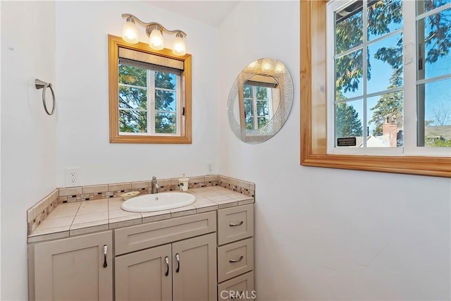 bathroom with vanity and a healthy amount of sunlight