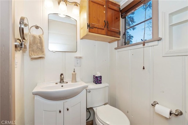 bathroom with vanity and toilet