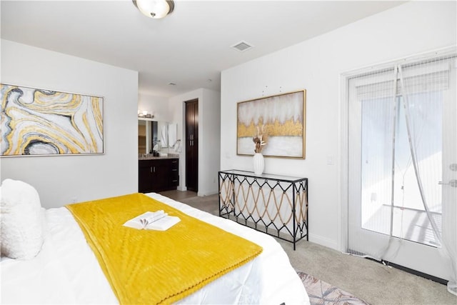 carpeted bedroom with ensuite bathroom