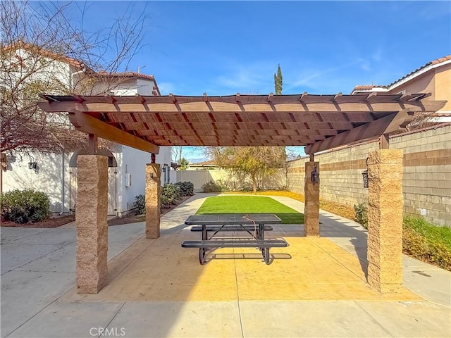 view of property's community with a yard, a patio area, and a pergola