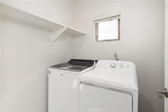 washroom with separate washer and dryer