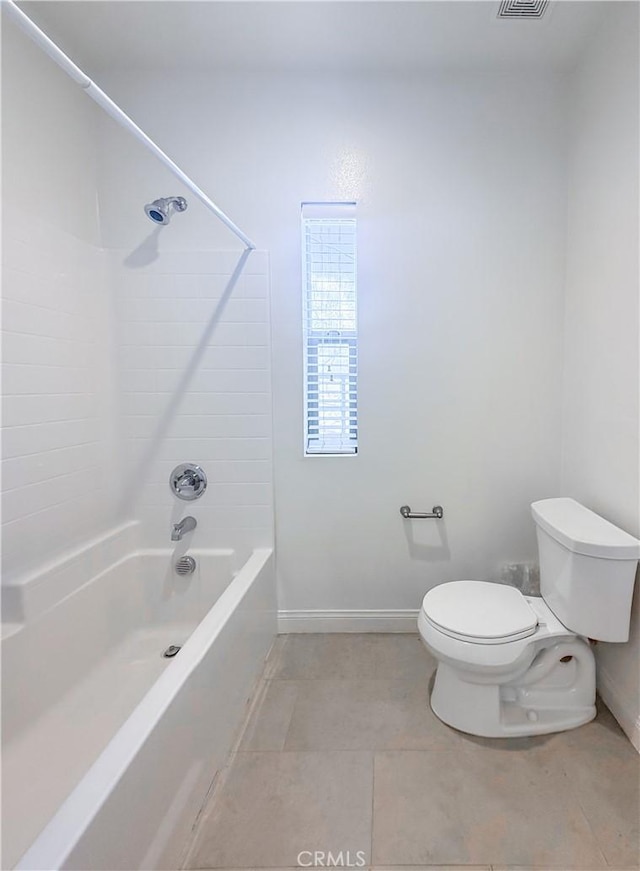 bathroom featuring tile patterned flooring,  shower combination, and toilet