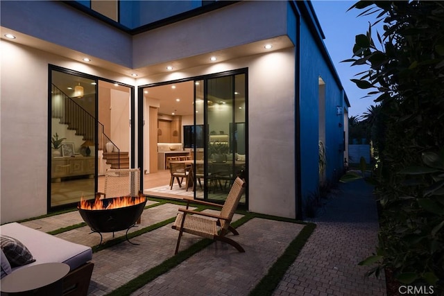 view of patio featuring a fire pit