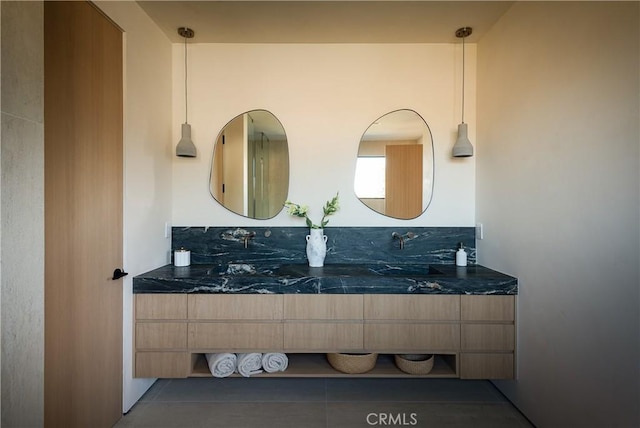 bathroom with vanity and tile patterned floors