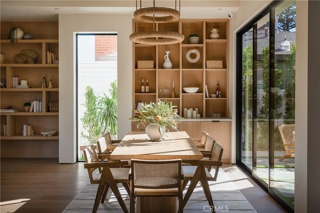 interior space featuring hardwood / wood-style flooring and built in shelves