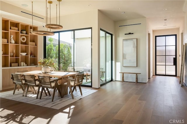 dining room with hardwood / wood-style floors