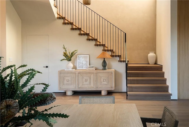 staircase with hardwood / wood-style flooring