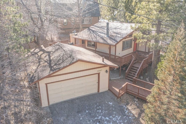 view of front facade featuring a garage and a deck