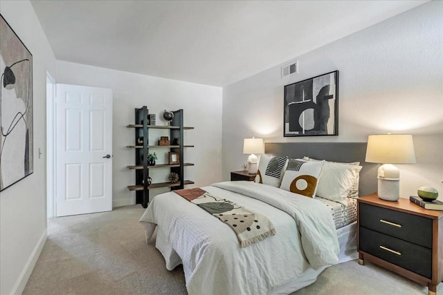 bedroom with light carpet