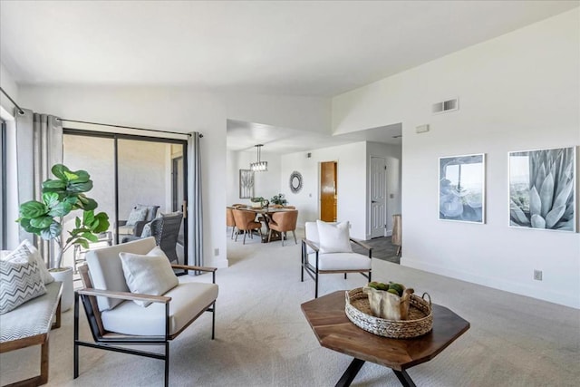 living room featuring lofted ceiling and light carpet