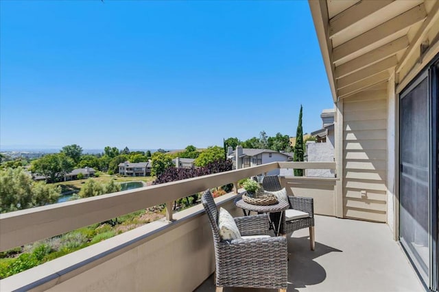 balcony featuring a water view