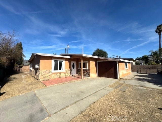 ranch-style house featuring a garage