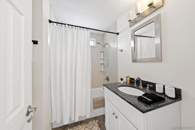 bathroom with tile patterned flooring, shower / bath combo, and vanity