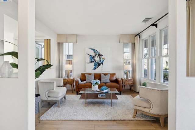 living room with light hardwood / wood-style floors