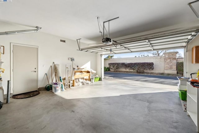 garage featuring a garage door opener