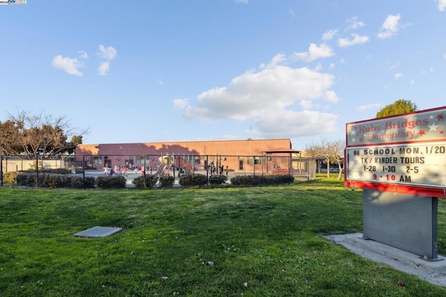 view of home's community with a yard