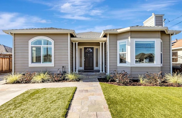 bungalow with a front yard