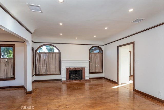 unfurnished living room featuring wood-type flooring