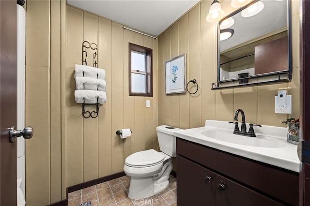 bathroom with vanity, toilet, and tile patterned flooring