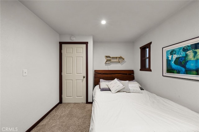 carpeted bedroom with baseboards
