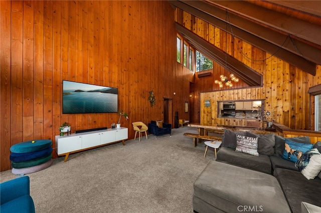 26834 Huron Rd, Lake Arrowhead, CA 92352 - carpeted living room with wood walls, high vaulted ceiling, and beamed ceiling