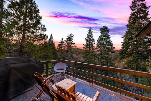 wooden deck featuring grilling area