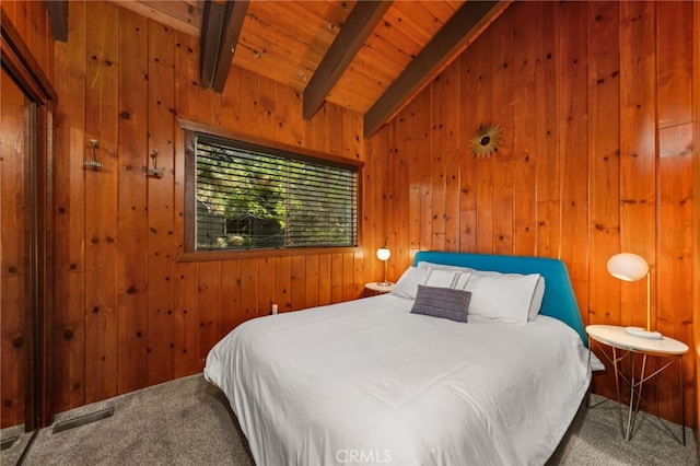 carpeted bedroom with lofted ceiling with beams, visible vents, wood ceiling, and wood walls