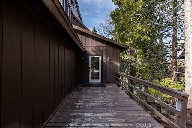 view of exterior entry with a deck