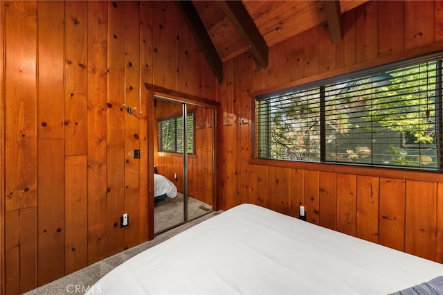 bedroom with wooden walls, wooden ceiling, and lofted ceiling with beams