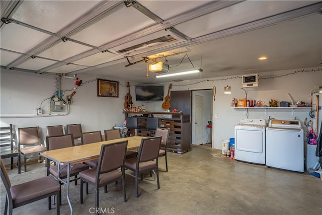 dining space with washing machine and clothes dryer and concrete flooring