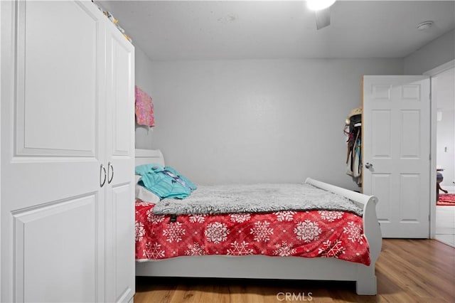 bedroom featuring hardwood / wood-style flooring and ceiling fan