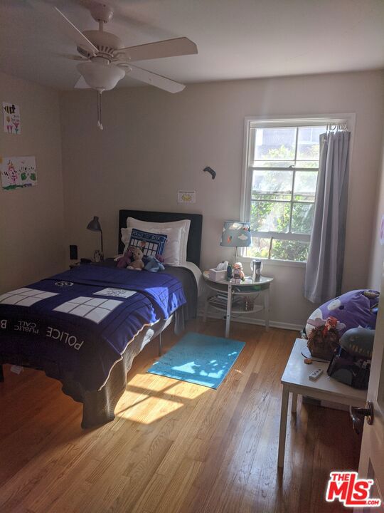 bedroom featuring ceiling fan and hardwood / wood-style floors